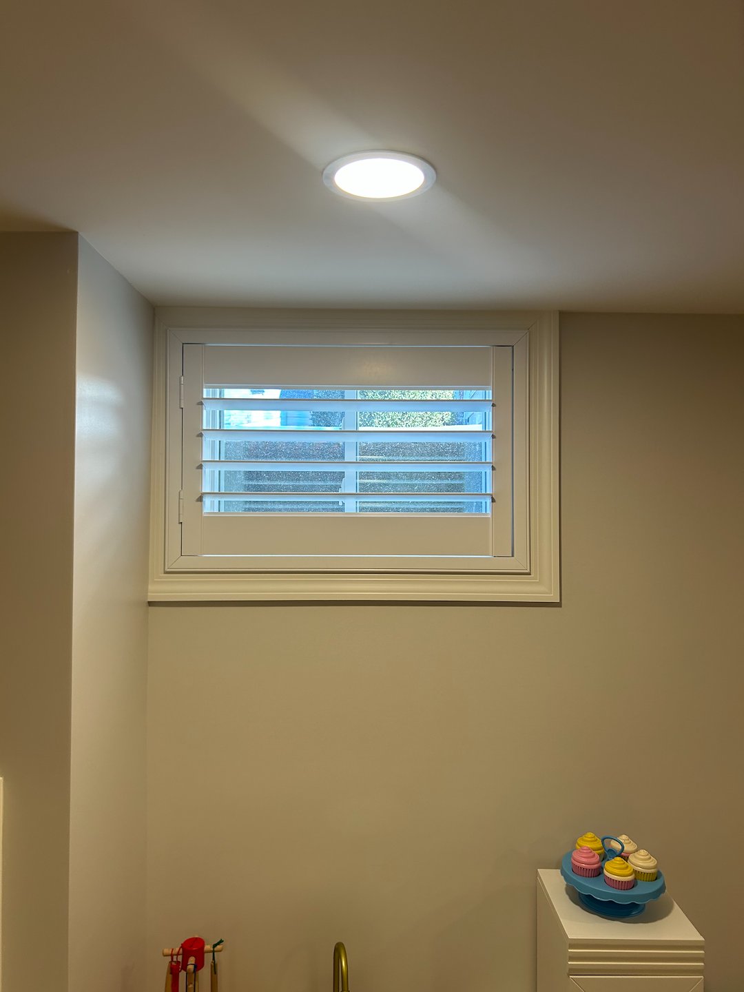 Unmatched Plantation Shutters on Small Basement Windows on Hawbrook Rd in Kirkwood, MO